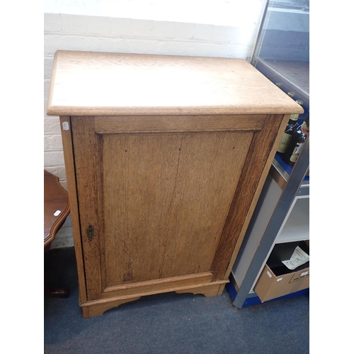 641 - A LIGHT OAK CUPBOARD, ON BRACKET FEET

73cm wide, a 1920s 'Jacobethan' style armchair, and a reprodu... 