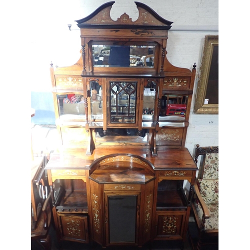 642 - A LATE VICTORIAN INLAID ROSEWOOD PARLOUR CABINET

the lower mirrored section flanked by cupboards an... 