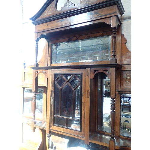 642 - A LATE VICTORIAN INLAID ROSEWOOD PARLOUR CABINET

the lower mirrored section flanked by cupboards an... 