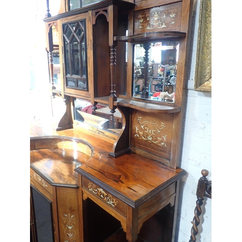 642 - A LATE VICTORIAN INLAID ROSEWOOD PARLOUR CABINET

the lower mirrored section flanked by cupboards an... 