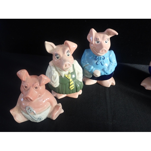 78 - SIX WADE NATWEST PIGS

with one other simular pig piggy bank. (7)