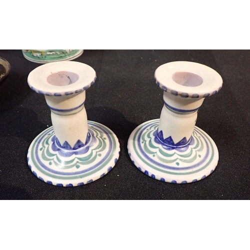 81 - A COLLECTION OF CERAMICS

including a pair of 1920s Poole candlesticks, Quimper plates and bowls, a ... 