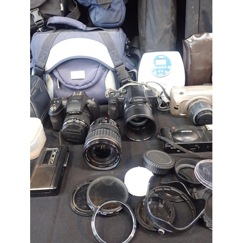 90 - A COLLECTION OF CAMERA EQUIPMENT

including a Fujifilm Finepix HS10 Digital camera, Canon lens and t... 