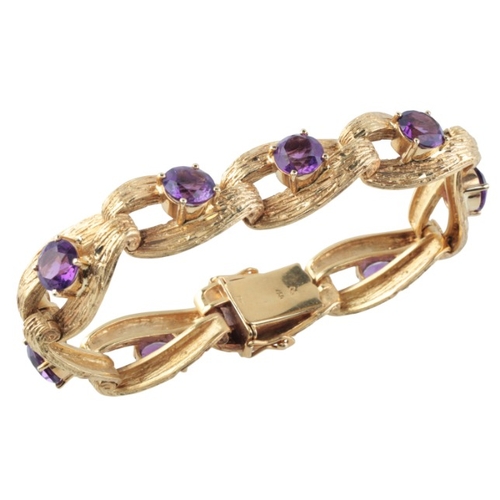 171 - A VINTAGE AMETHYST BRACELET

in 18ct gold, comprising a series of stylised textured links, each set ... 