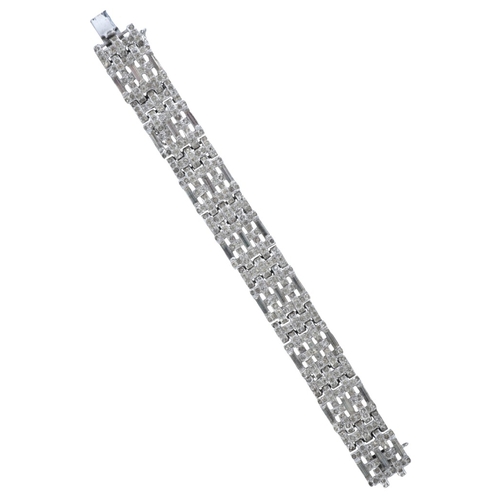 176 - AN ART DECO STYLE PASTE BRACELET

comprising a series of links in a woven design, set throughout wit... 