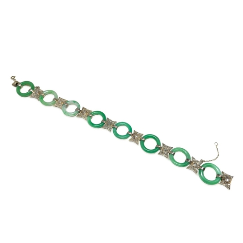 179 - A BELLE ÉPOQUE JADE AND DIAMOND BRACELET

in platinum, comprising a series of carved jadeite jade ri... 