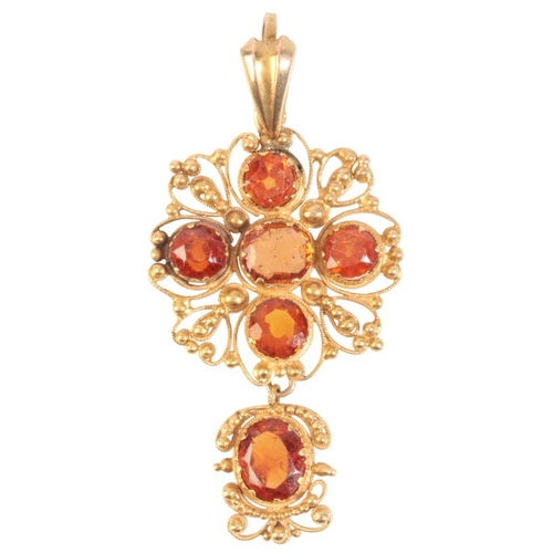 182 - A HESSONITE GARNET PENDANT

in 18ct gold, set with round cut hessonite garnets, suspending a hessoni... 