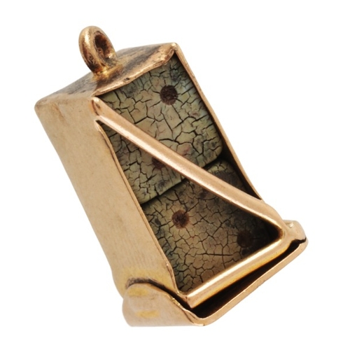 205 - A VINTAGE DICE CHARM PENDANT

in 9ct gold, comprising two painted dice, secured in a stylised open c... 