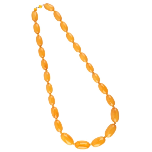 214 - AN AMBER NECKLACE

comprising a series of beads, alternating with faceted orange beads, (c.69.7g)