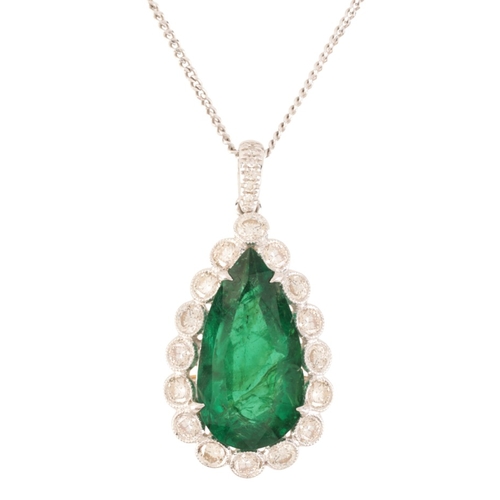 215 - AN EMERALD AND DIAMOND CLUSTER PENDANT NECKLACE

in 18ct yellow and white gold, set with a pear cut ... 