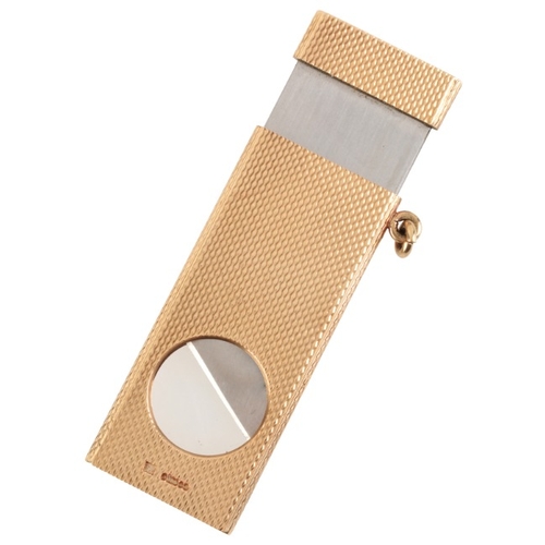 218 - KURT WEISS: A VINTAGE CIGAR CUTTER PENDANT

in 9ct gold, with engine-turned detailing, maker's mark ... 