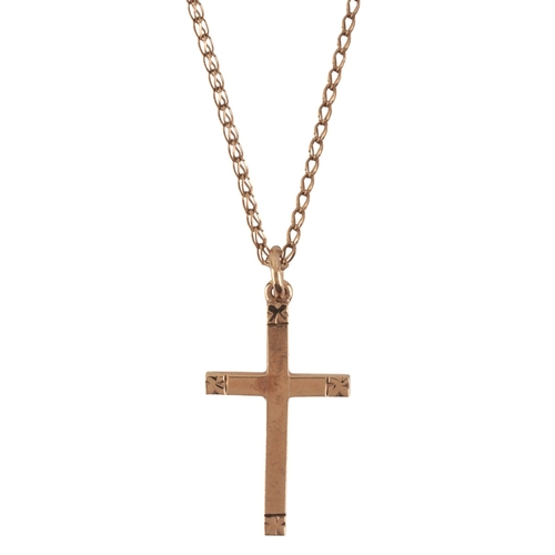 219 - A CROSS PENDANT NECKLACE

in 9ct gold, with stylised details to the terminals, suspended from a fanc... 