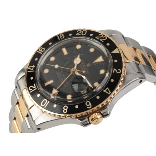 266 - ROLEX GMT-MASTER: A GENTLEMAN'S BI-METAL BRACELET WATCH

with automatic movement, the black dial wit... 