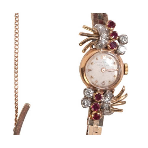 273 - UNIVERSAL GENEVE: A LADY'S 9CT GOLD, DIAMOND AND RUBY-SET COCKTAIL WATCH

with manual wind movement,... 