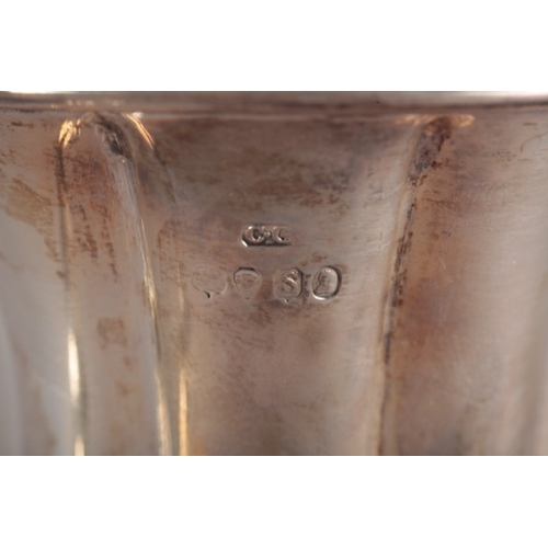 484 - A WILLIAM IV SILVER CHRISTENING TANKARD

by Charles Gordon, London 1833, of panelled baluster form w... 