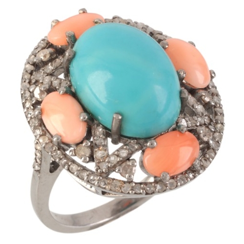 67 - A GEM-SET CLUSTER RING

in sterling silver, set with a turquoise cabochon of c.5.28 carats, surround... 