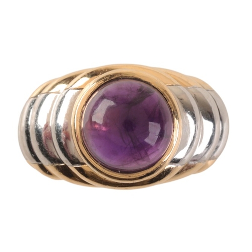 78 - MAUBOUSSIN: AN AMETHYST DRESS RING

in 18ct yellow and white gold, in a stylised stepped design, set... 