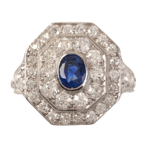 80 - A BURMA NO HEAT SAPPHIRE AND DIAMOND CLUSTER RING

in platinum, set with an oval cut Burmese sapphir... 