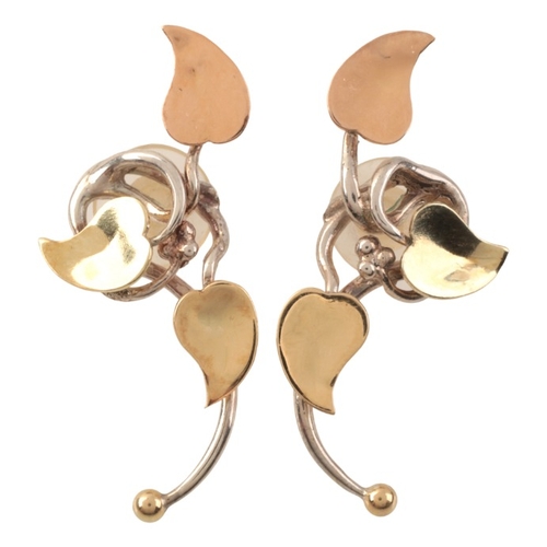 95 - BRETT PAYNE: A PAIR OF 'FLOWER' EARRINGS

in sterling silver and 18ct yellow and rose gold, each com... 