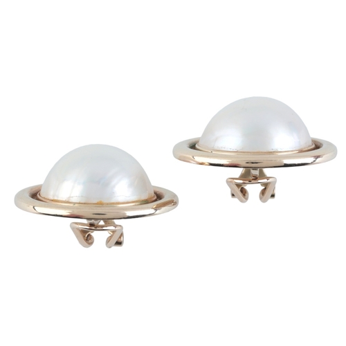 96 - A PAIR OF MABÉ PEARL CLIP EARRINGS

in 9ct gold, each set with mabé pearl of c.17.0mm, surrounded by... 