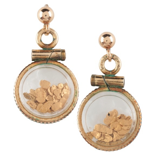 98 - A PAIR OF DROP EARRINGS

in gold, each comprising a gold stud, hinged to a compartment containing go... 