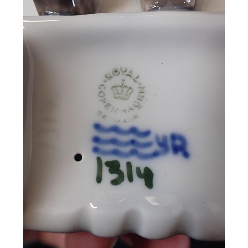 70 - A  ROYAL COPENHEGEN FIGURE

with a Canadian glass bowl, Wade pig and other mixed ceramics.