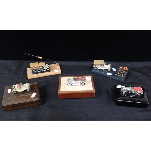 82 - A GROUP OF MODEL CAR MOUNTED DESK ORNAMENTS AND BOXES

wood, ceramic etc, the cars with silvered fin... 