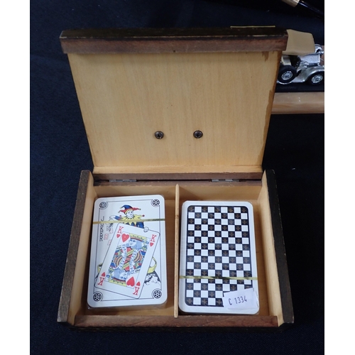 82 - A GROUP OF MODEL CAR MOUNTED DESK ORNAMENTS AND BOXES

wood, ceramic etc, the cars with silvered fin... 