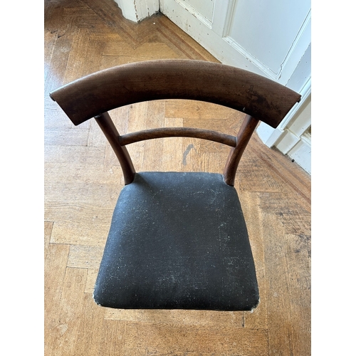 27 - A SET OF FOUR REGENCY MAHOGANY SIDE CHAIRS

the scrolled bar backs over square covered seats, on lob... 