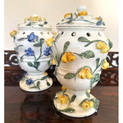 49 - A NEAR PAIR OF CONTINENTAL FAIENCE POT POURRI VASES

of baluster form with pierced covers and collar... 