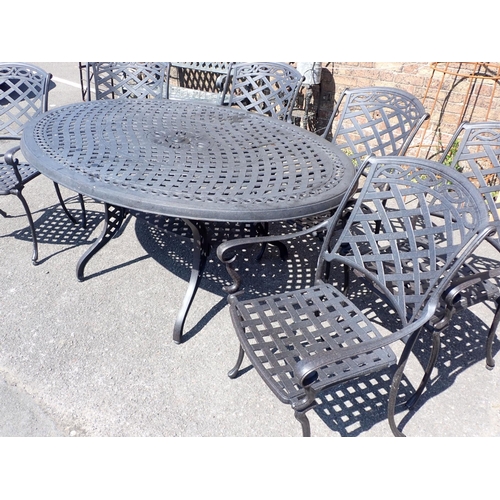 3 - A CAST METAL OVAL GARDEN TABLE AND SIX CHAIRS

with lattice design, the table 115 x 168cm