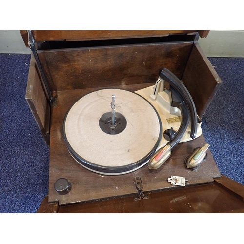 30 - A 1950s HMV MODEL 2127 ELECTRIC GRAMOPHONE

walnut cased, with dual-action opening, and interchangea... 