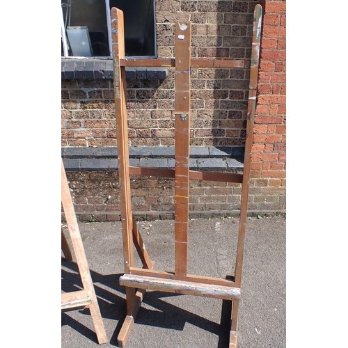54 - AN ARTISTS' STUDIO EASEL

60cm wide, and another folding easel (2)