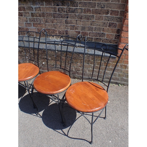 7 - A SET OF FOUR SCROLLED METAL GARDEN/CONSERVATORY CHAIRS

with round wooden seats