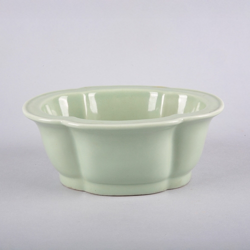 118 - A CHINESE PORCELAIN CELADON LOBED BOWL

bearing a six character Daoguang seal mark to the base and p... 