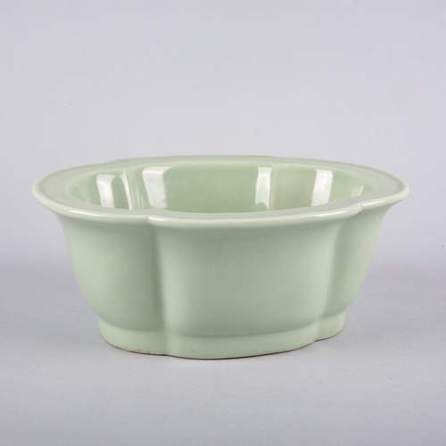 118 - A CHINESE PORCELAIN CELADON LOBED BOWL

bearing a six character Daoguang seal mark to the base and p... 