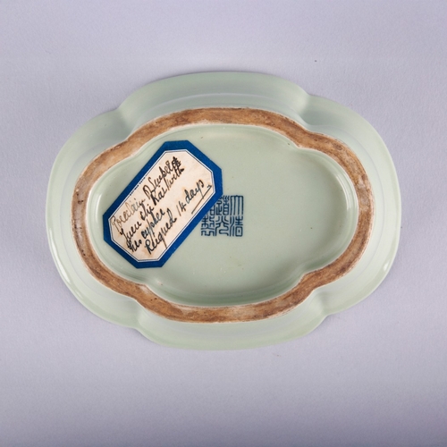 118 - A CHINESE PORCELAIN CELADON LOBED BOWL

bearing a six character Daoguang seal mark to the base and p... 