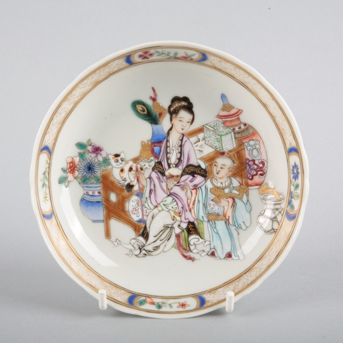 162 - A CHINESE PORCELAIN FAMILLE ROSE TEABOWL AND SAUCER

the moulded bowl with a shaped rim and decorate... 
