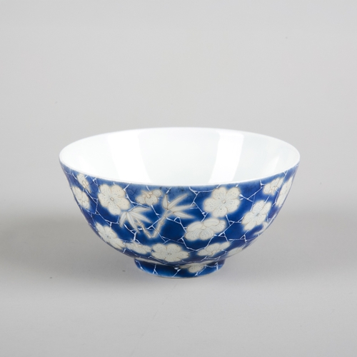 78 - A CHINESE PORCELAIN BLUE AND WHITE 'CRACKED ICE' CUP

bearing a four character mark to the base, lat... 