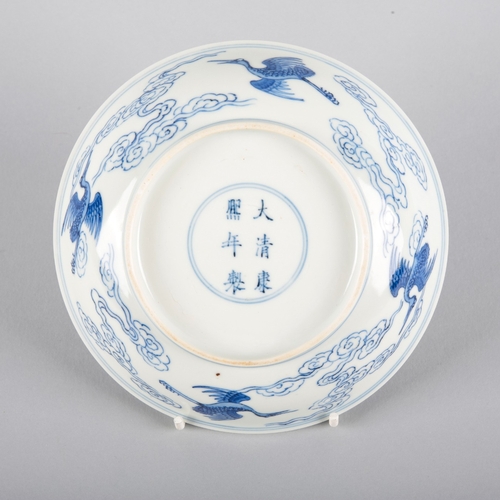 79 - A CHINESE BLUE AND WHITE PORCELAIN DISH

bearing a six-character Kangxi mark, the interior decorated... 