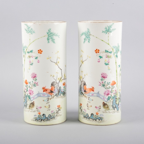 97 - A PAIR OF CHINESE PORCELAIN CYLINDER VASES OR HAT STANDS

each bearing four character marks to the b... 
