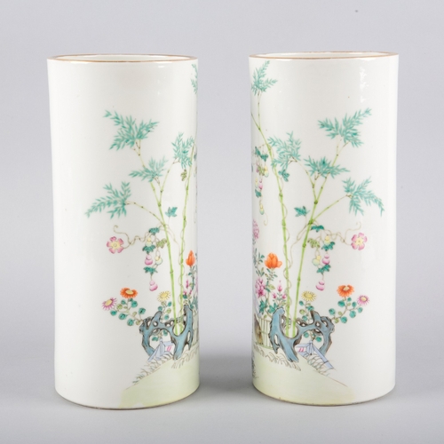 97 - A PAIR OF CHINESE PORCELAIN CYLINDER VASES OR HAT STANDS

each bearing four character marks to the b... 