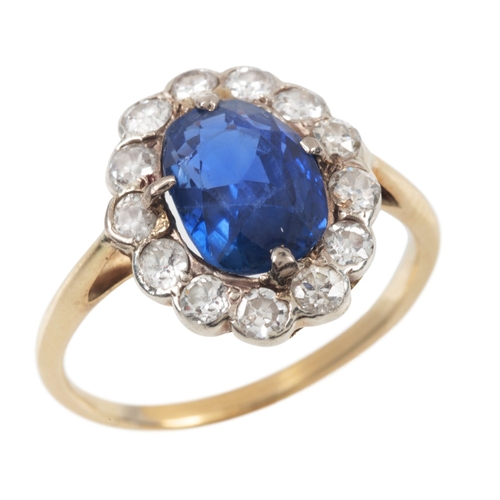 128 - A BURMA NO HEAT SAPPHIRE AND DIAMOND CLUSTER RING

in silver on 18ct gold, set with an oval sapphire... 