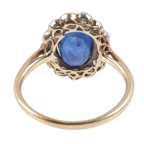 128 - A BURMA NO HEAT SAPPHIRE AND DIAMOND CLUSTER RING

in silver on 18ct gold, set with an oval sapphire... 
