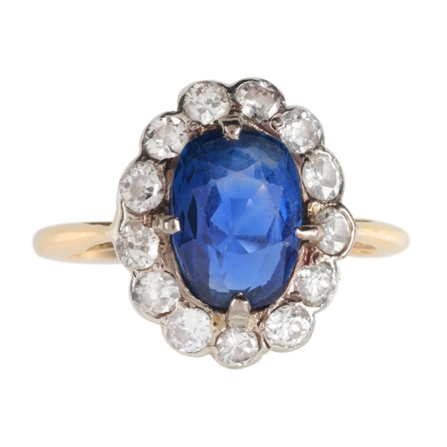 128 - A BURMA NO HEAT SAPPHIRE AND DIAMOND CLUSTER RING

in silver on 18ct gold, set with an oval sapphire... 