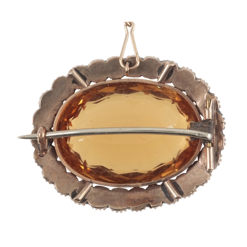 152 - A CITRINE AND SEED PEARL BROOCH

set in unmarked yellow metal, with attached safety chain, c. 32mm w... 