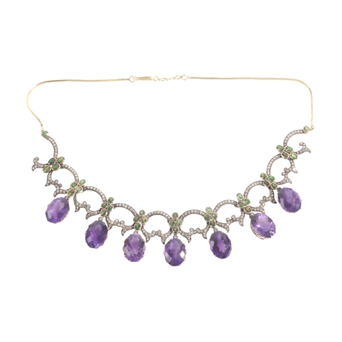 262 - AN ART NOUVEAU STYLE AMETHYST, GARNET AND DIAMOND FRINGE NECKLACE

in silver on gold, set with a fri... 