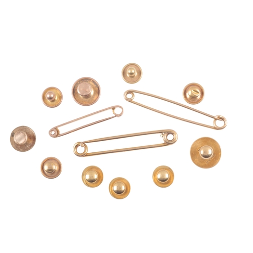 305 - A COLLECTION OF DRESS STUDS

comprising a set of four 18ct gold dress studs and one other, hallmarke... 