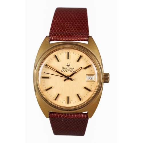 507 - BULOVA ACCUTRON: A GOLD-PLATED WRISTWATCH

with gold dial, gold and black baton numerals, date apert... 