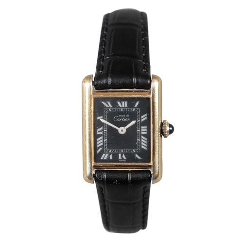 509 - CARTIER: A LE MUST DE CARTIER SILVER GILT WRISTWATCH

with manual wind movement, black dial, silver ... 